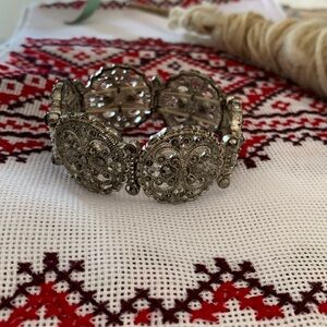 Ornate silver tone bracelet with faux hematite stones. GUC.